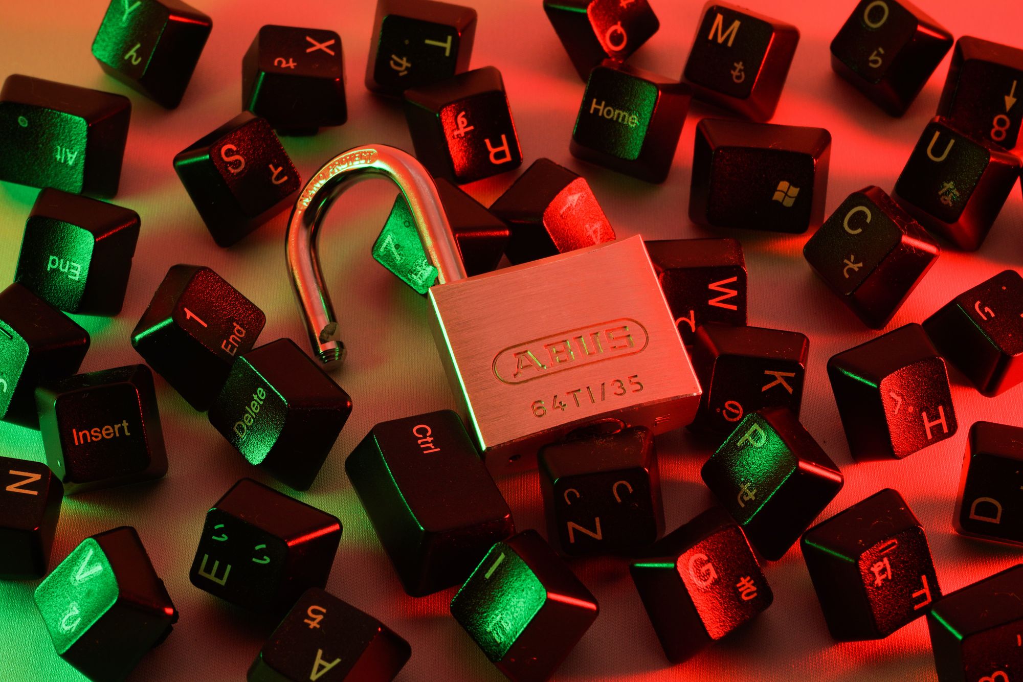 A padlock surrounded by various computer keys, representing the concept of cybersecurity and data protection.