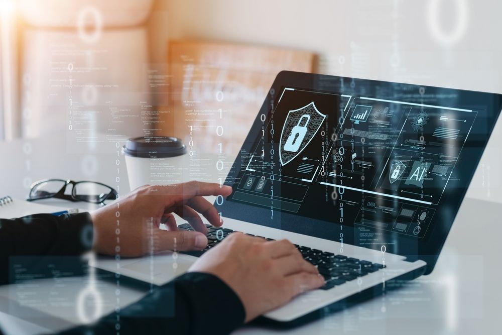 Laptop screen displaying a security and data protection concept with icons representing cybersecurity measures.