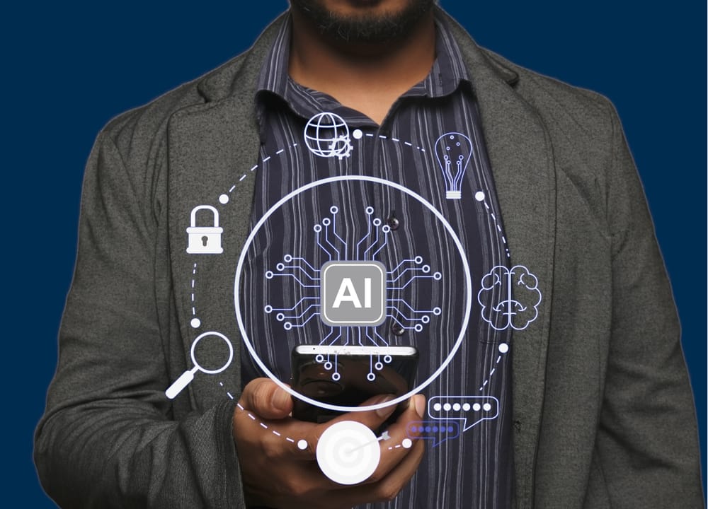 A man grasping a phone with various AI icons hovering around, depicting the theme of AI and machine learning technology.