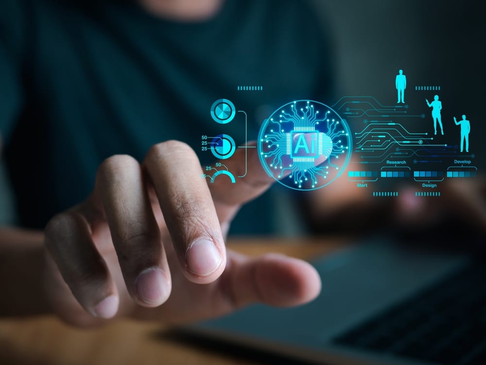 A man interacts with a laptop featuring digital icons symbolizing artificial intelligence.
