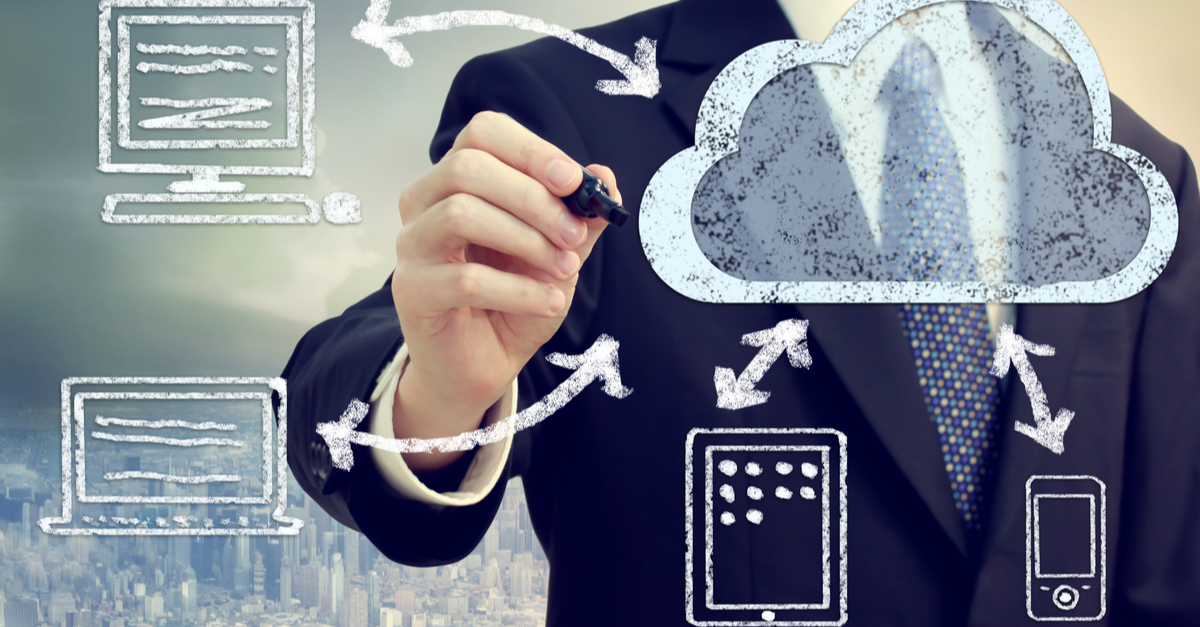 1. Businessman sketching a cloud computing concept on a transparent board, illustrating digital connectivity and data storage.
