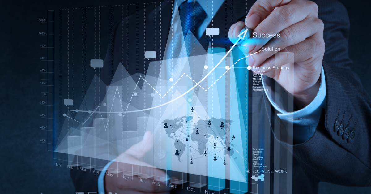 Businessman analyzing data by drawing graphs on a digital screen in a modern office setting.