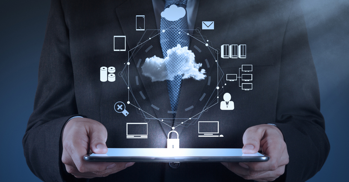 Businessman holding a tablet displaying various cloud computing icons, symbolizing digital technology and innovation.