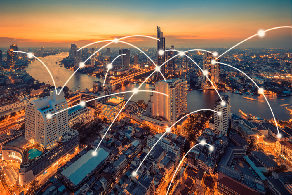 A city skyline with digital connections symbolizing internet access throughout the urban landscape.