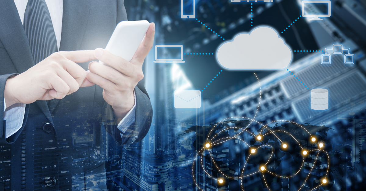 Businessman engaged with a smartphone, featuring cloud computing icons that symbolize modern digital solutions and connectivity.