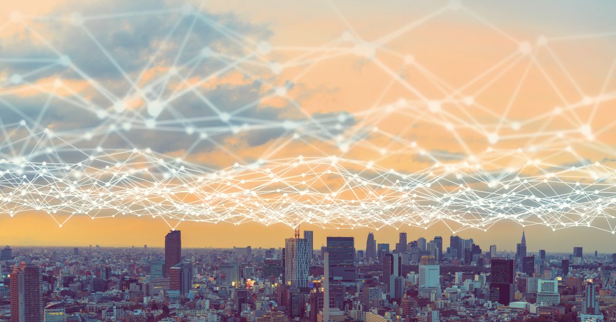 A panoramic city skyline illustrating network connectivity, representing the future of the Internet of Things.