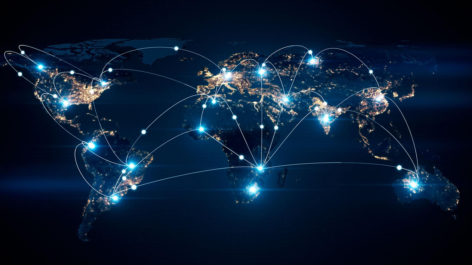 World map with illuminated network lines connecting various locations on a dark background, symbolizing global connectivity.