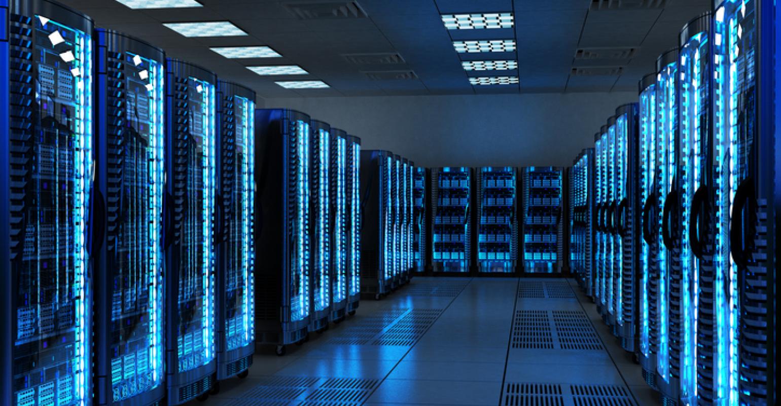 A series of servers in a data center, neatly arranged in rows, highlighting the technology infrastructure.