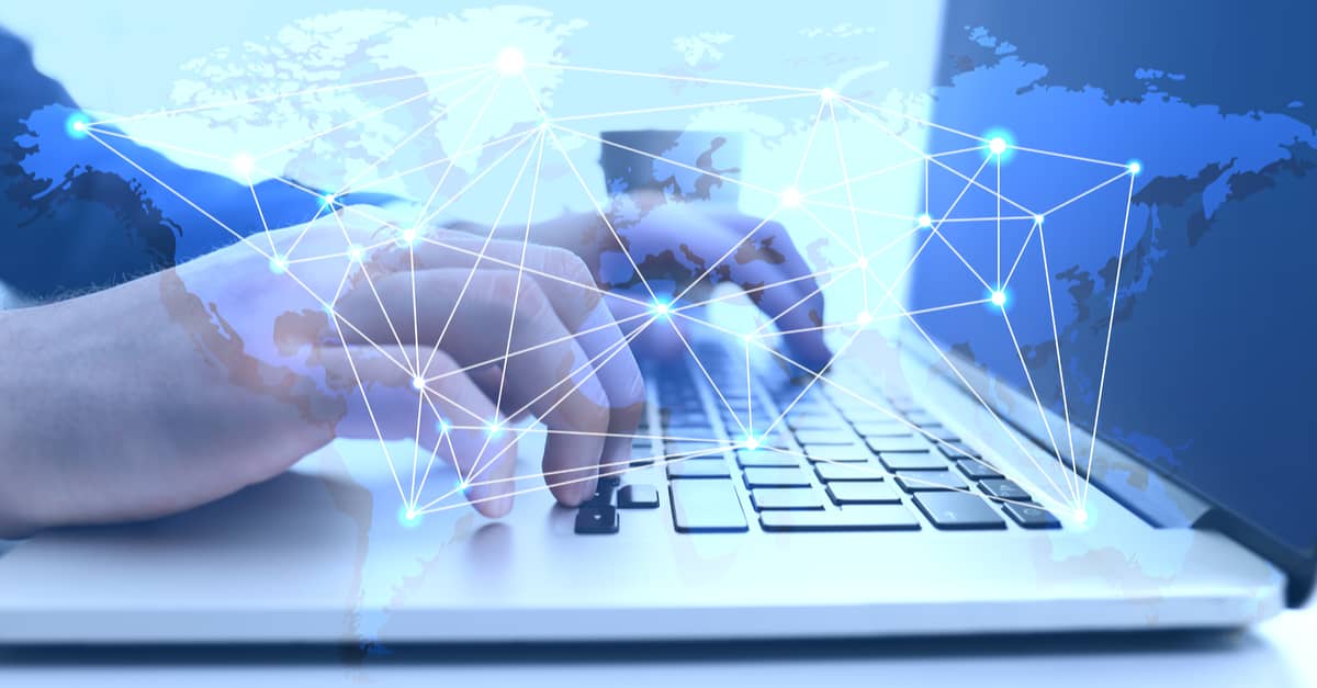 A person using a laptop, symbolizing global connectivity through the internet.