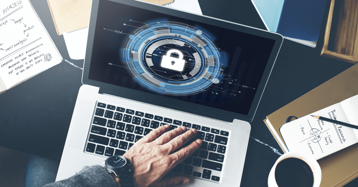 Individual working on a laptop, focused on strategies for safeguarding data against cyber threats.