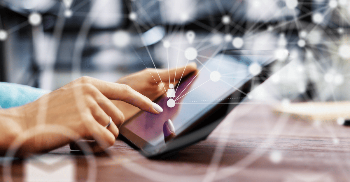Individual working remotely on a tablet, learning how to leverage email marketing for business expansion.