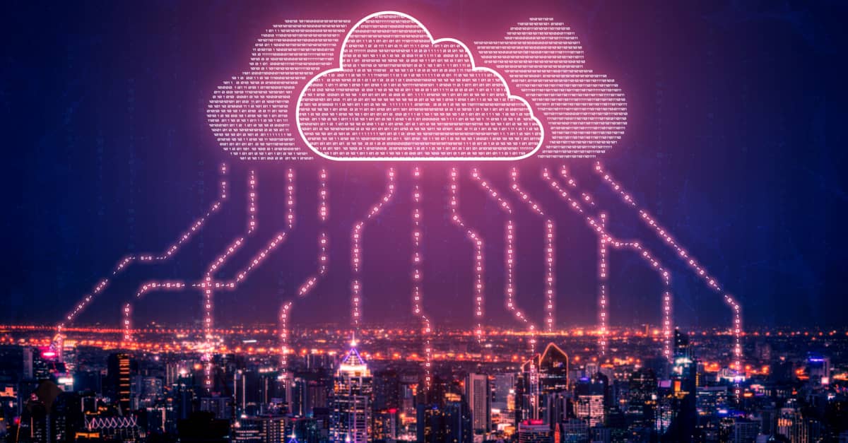 Urban landscape featuring cloud computing icons and flowing digital data, representing modern technology in city environments.