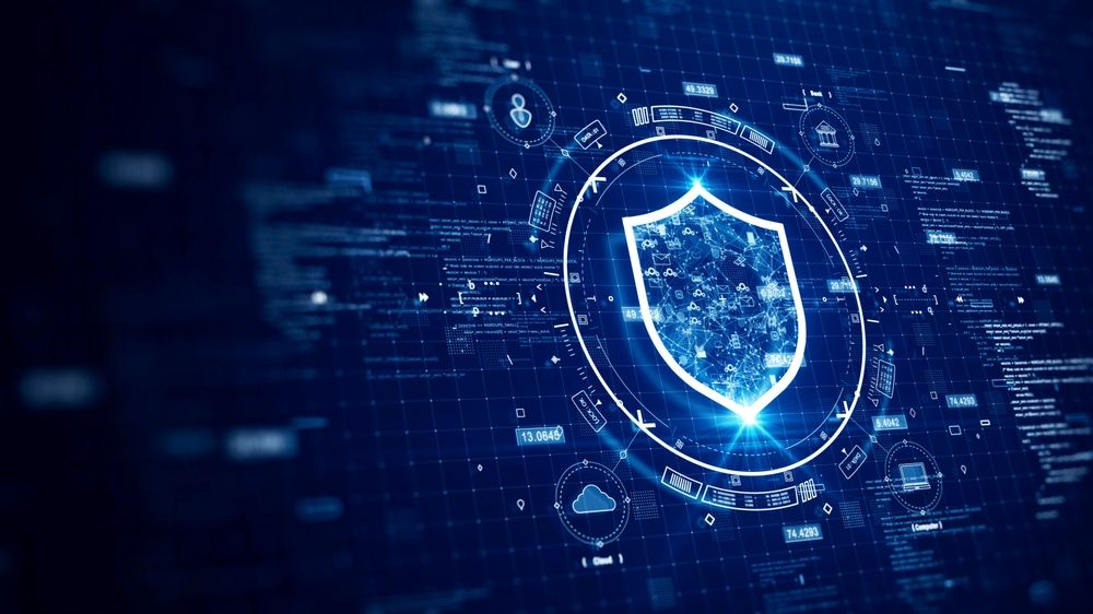 Security shield icon set against a digital background, symbolizing cybersecurity and protection of information.