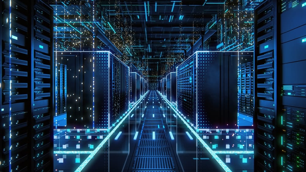 A spacious room filled with numerous servers and illuminated by bright lights.